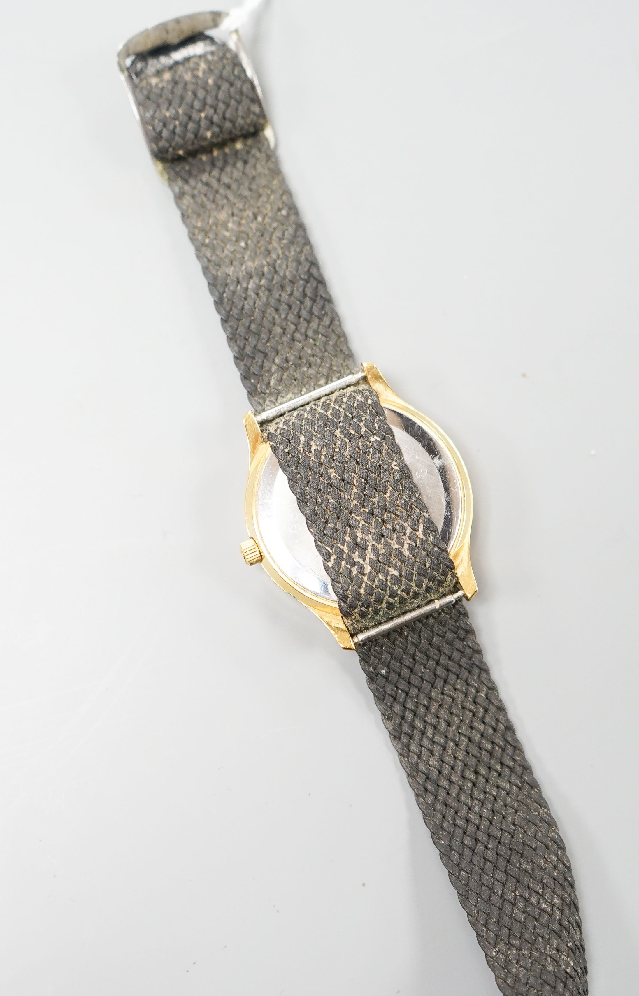 A gentleman's steel and gold plated Omega Seamaster quartz wrist watch, on associated fabric strap, no box or papers